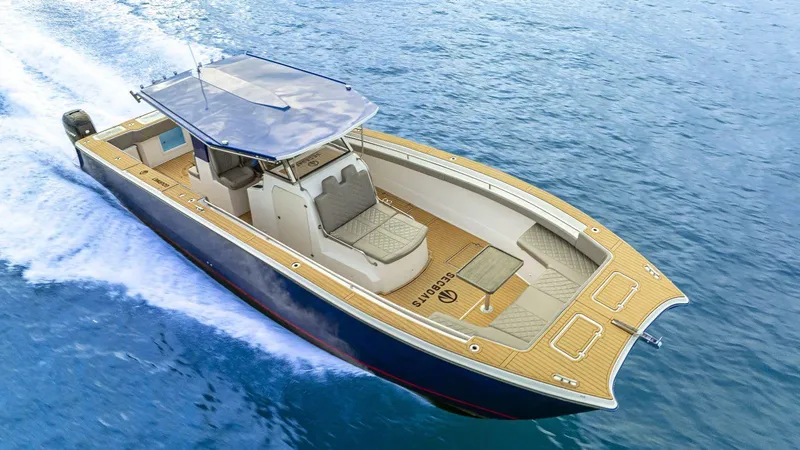Slide: The Image of Custom Catamaran Sec CatFish 39, 2023 model, cruising on blue ocean waters. - 3