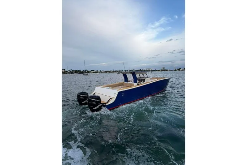 Slide: The Image of Custom 2024 Catamaran SET CAT with dual Mercury engines on open water. - 34