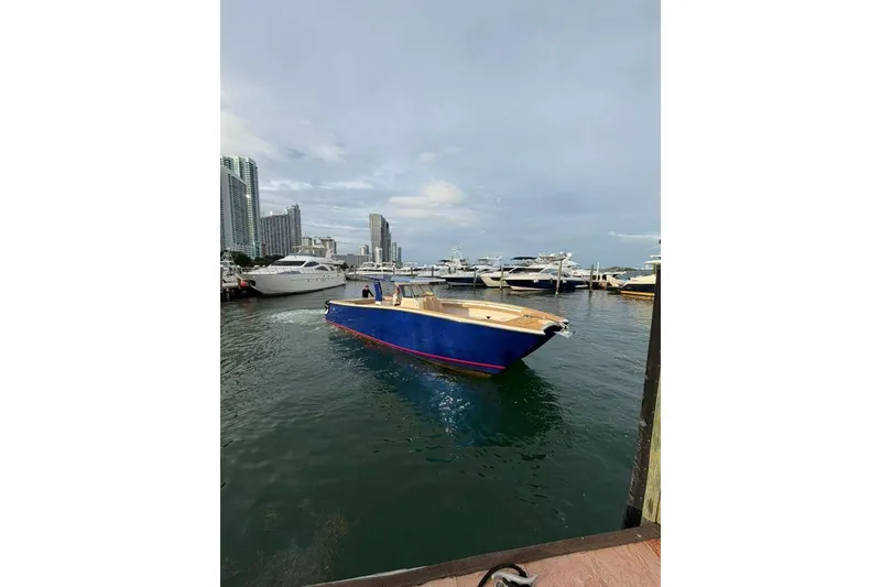 Slide: The Image of Custom 2024 Catamaran SET CAT in marina, surrounded by yachts and city skyline. - 47