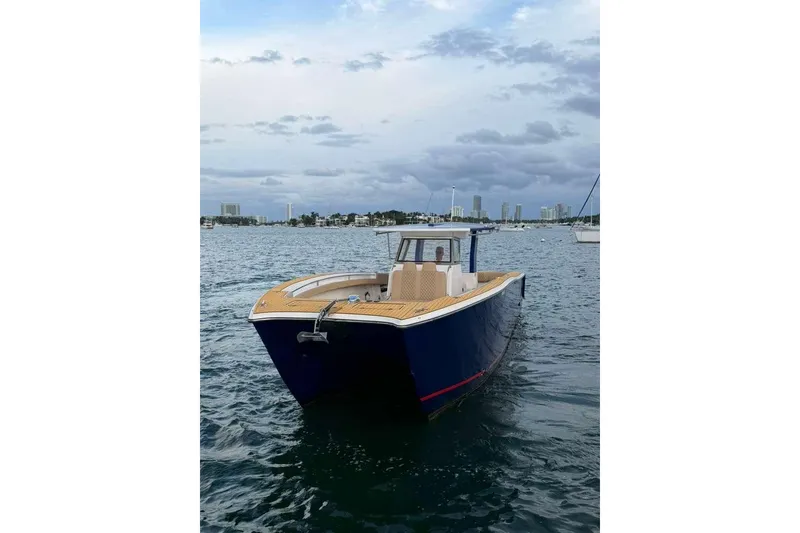 Slide: The Image of 2024 Custom Catamaran SET CAT on water, showcasing sleek design and modern features. - 68