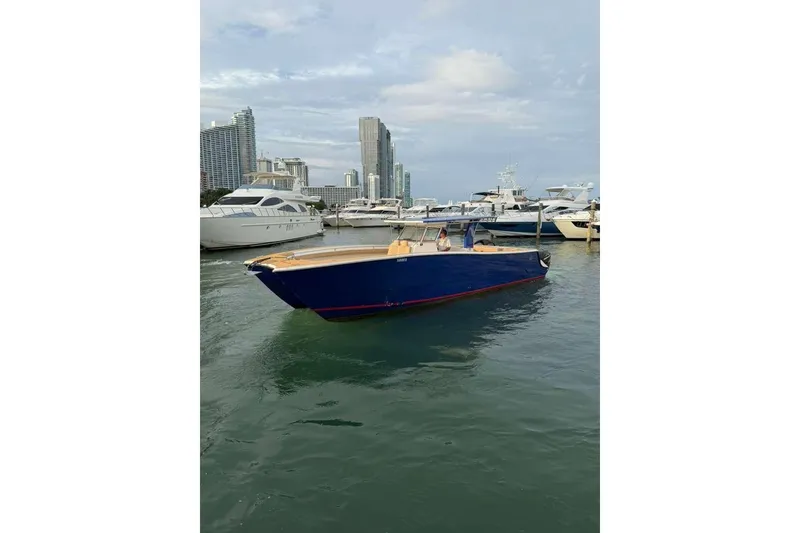 Slide: The Image of Custom 2024 Catamaran SET CAT in marina, surrounded by yachts and city skyline. - 69