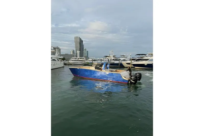 Slide: The Image of 2024 Custom Catamaran SET CAT in marina, surrounded by yachts and city skyline. - 76