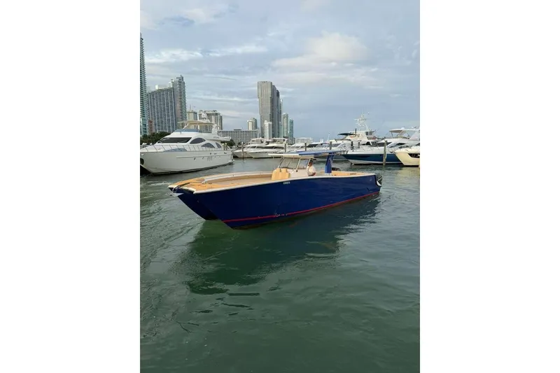 Slide: The Image of 2024 Custom Catamaran SET CAT in marina, surrounded by modern cityscape and yachts. - 81