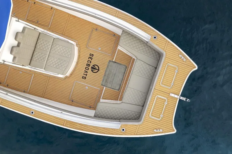 Slide: The Image of Top view of 2024 Custom Catamaran SET CAT with teak deck and cushioned seating. - 83