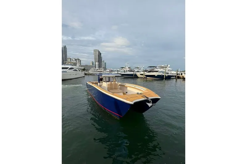 Slide: The Image of 2024 Custom Catamaran SET CAT in marina, sleek design, city skyline background. - 97