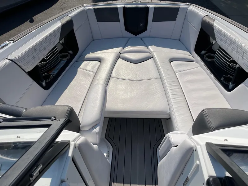 Slide: The Image of 2017 Nautique Super Air Nautique G25 boat interior with white leather seating. - 11