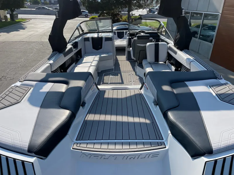 Slide: The Image of 2017 Nautique Super Air Nautique G25 boat interior with sleek seating and modern design. - 4