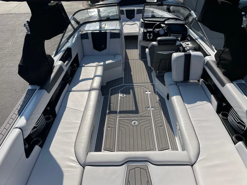 Slide: The Image of 2017 Nautique Super Air Nautique G25 interior with luxurious seating and sleek design. - 5