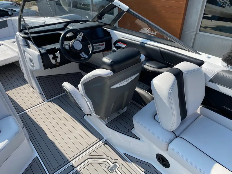 Slide: The Image of 2017 Nautique Super Air Nautique G25 interior with sleek seating and modern dashboard. - 6
