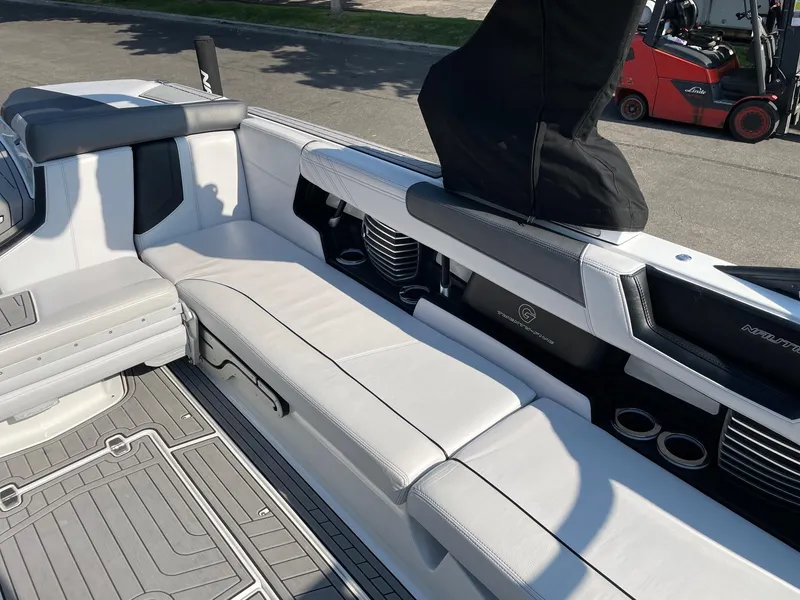 Slide: The Image of 2017 Nautique Super Air Nautique G25 interior with white seating and sleek design. - 9