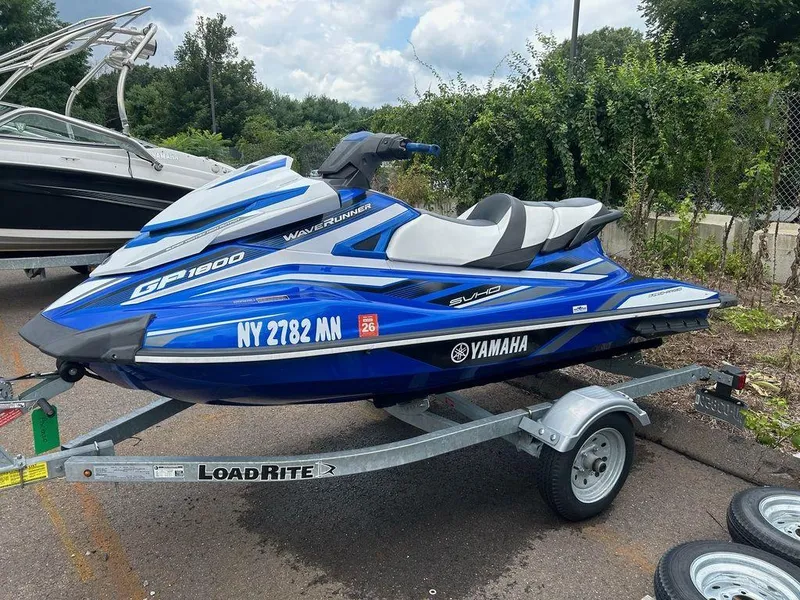 Slide: The Image of Blue 2017 Yamaha WaveRunner GP1800 on trailer, parked outdoors. - 1