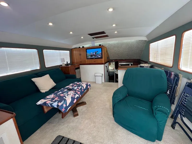 Slide: The Image of Interior of 1987 Ocean Yachts Super Sport with cozy seating and modern amenities. - 3