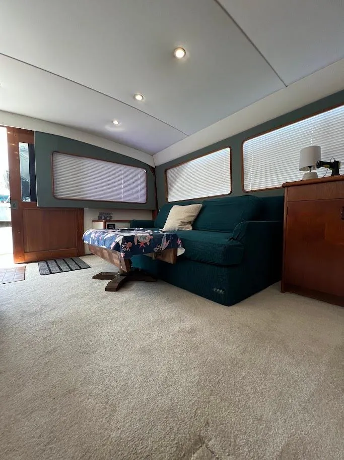 Slide: The Image of Interior of 1987 Ocean Yachts Super Sport with cozy seating and natural light. - 4