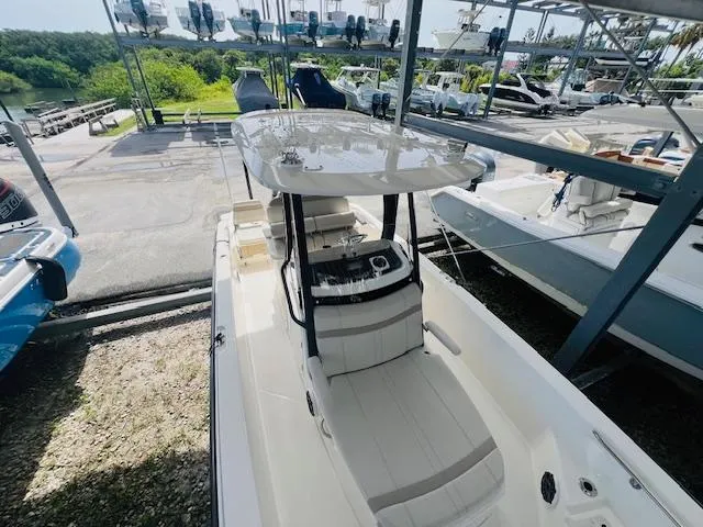Slide: The Image of 2023 Boston Whaler 250 Dauntless boat in storage, featuring sleek design and spacious deck. - 10