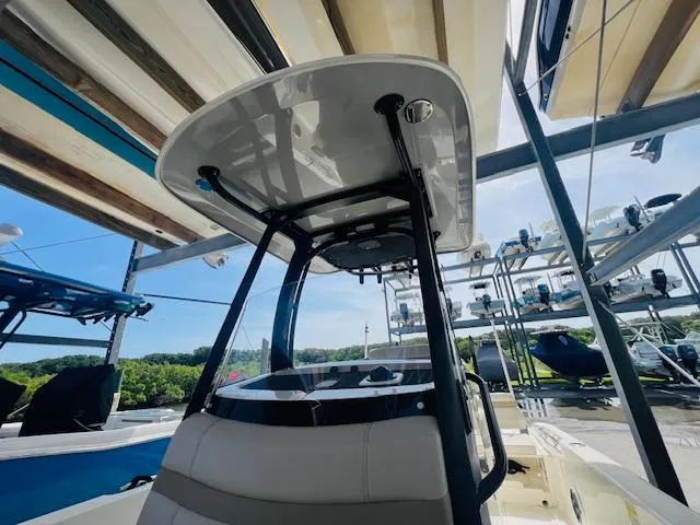 Slide: The Image of 2023 Boston Whaler 250 Dauntless boat in storage, showcasing sleek design and sturdy construction. - 14