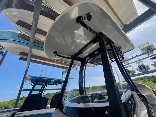 Slide: The Image of 2023 Boston Whaler 250 Dauntless boat in storage, showcasing sleek design and modern features. - 15