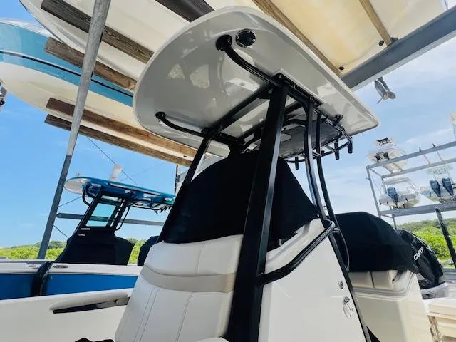 Slide: The Image of 2023 Boston Whaler 250 Dauntless boat interior with T-top and seating. - 22