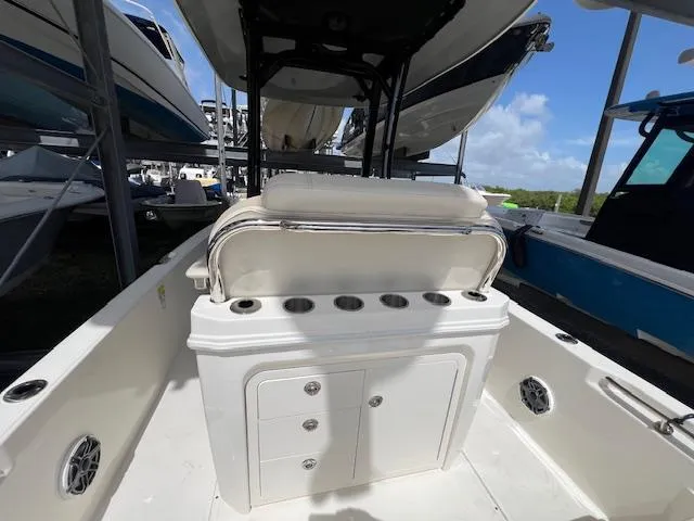 Slide: The Image of 2023 Boston Whaler 250 Dauntless boat interior with seating and storage compartments. - 29