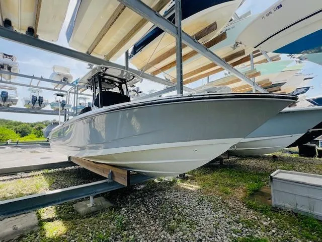 Slide: The Image of 2023 Boston Whaler 250 Dauntless boat on storage rack, side view. - 3