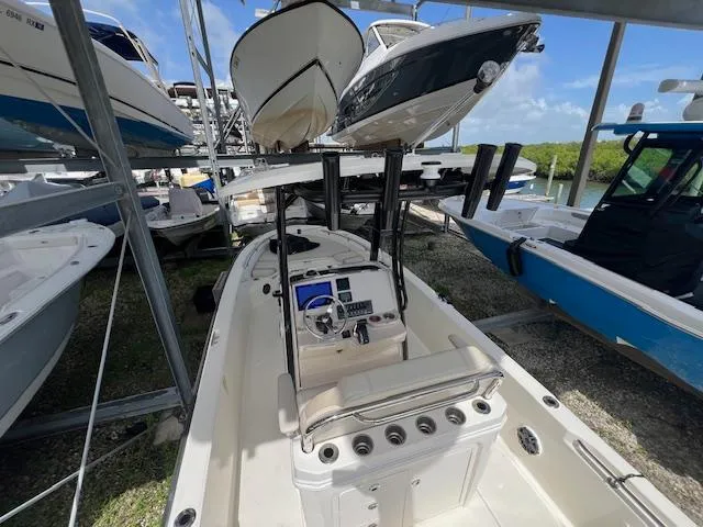 Slide: The Image of 2023 Boston Whaler 250 Dauntless boat in storage, surrounded by other vessels. - 31
