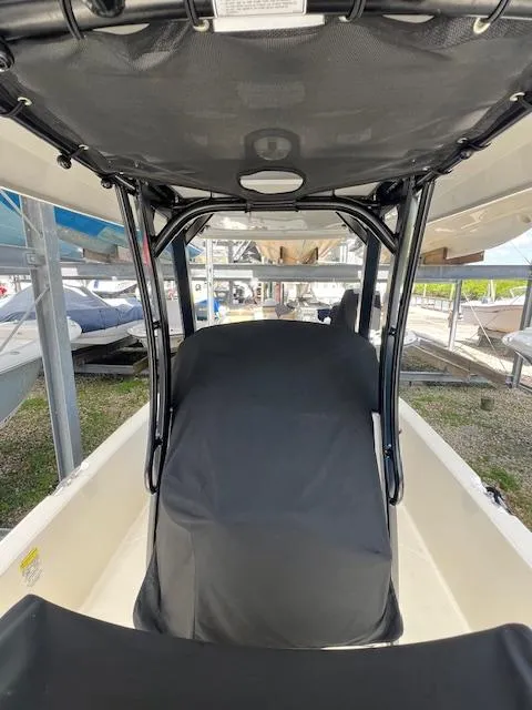 Slide: The Image of 2023 Boston Whaler 250 Dauntless boat interior with covered seating and canopy. - 35