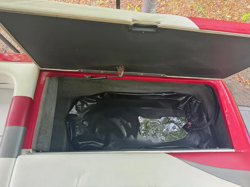 Slide: The Image of 2011 Moomba Mobius LSV storage compartment with black interior lining. - 7