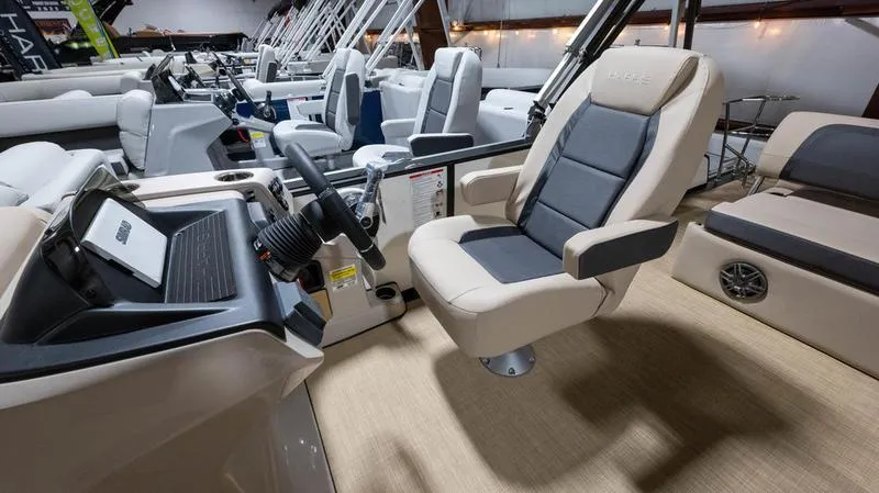 Slide: The Image of Interior of 2025 Harris Cruiser 230 SLDH with luxurious captain's chair. - 11