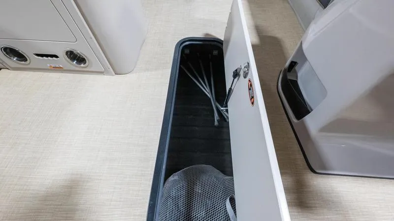 Slide: The Image of Storage compartment in Harris Cruiser 230 SLDH 2025 boat. - 17