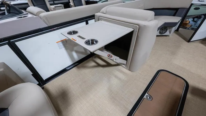 Slide: The Image of Interior of 2025 Harris Cruiser 230 SLDH with foldable table and cup holders. - 18