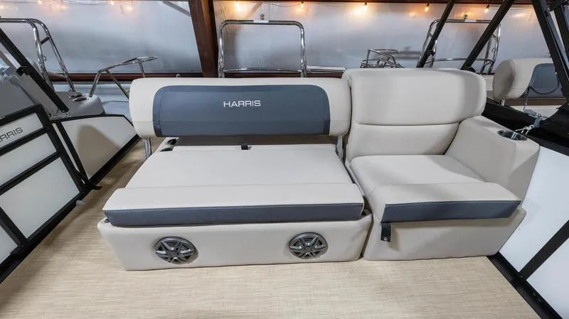 Slide: The Image of Interior of 2025 Harris Cruiser 230 SLDH with beige seating area. - 19