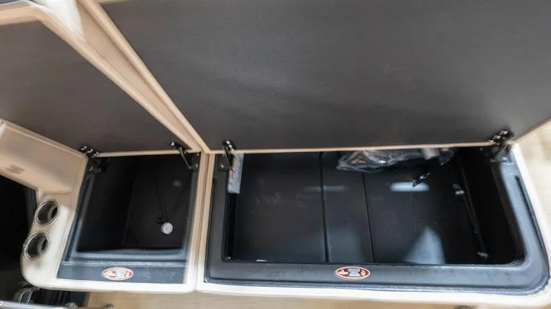 Slide: The Image of 2025 Harris Cruiser 230 SLDH storage compartments open. - 23