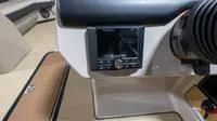 Slide: The Image of Interior of 2025 Harris Cruiser 230 SLDH with control console. - 38