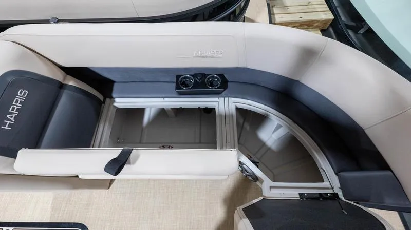 Slide: The Image of Interior of 2025 Harris Cruiser 230 SLDH with seating and storage area. - 4