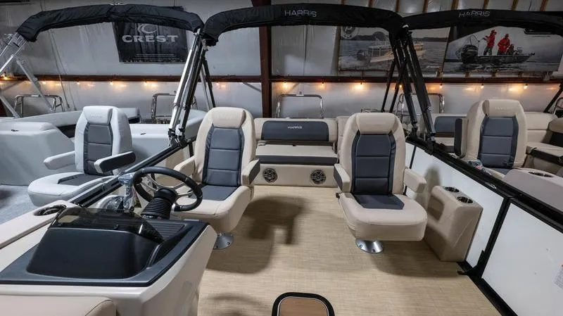 Slide: The Image of Interior of 2025 Harris Cruiser 230 SLDH with luxurious seating. - 9