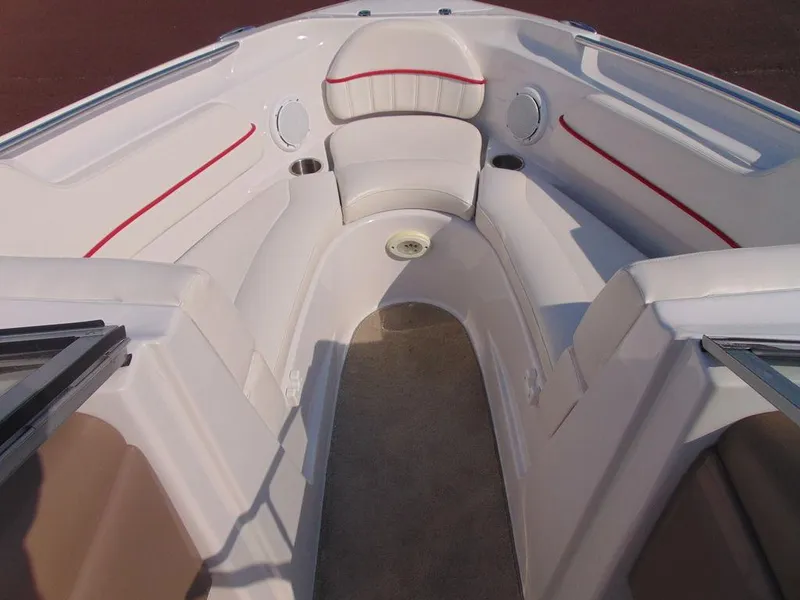 Slide: The Image of 2009 Four Winns H210 boat interior with white seating and red accents. - 13