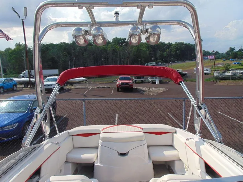 Slide: The Image of 2009 Four Winns H210 boat interior with red accents and stainless steel tower. - 14