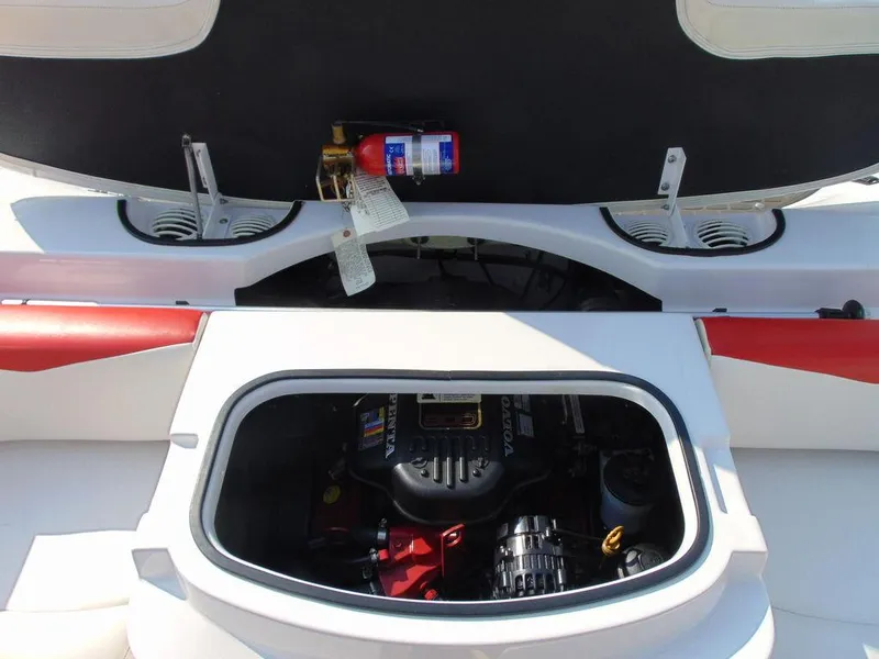 Slide: The Image of 2009 Four Winns H210 boat engine compartment with fire extinguisher. - 15