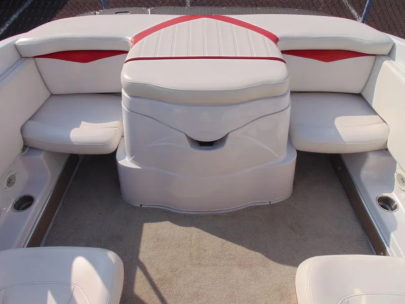 Slide: The Image of 2009 Four Winns H210 boat interior with white and red seating. - 16