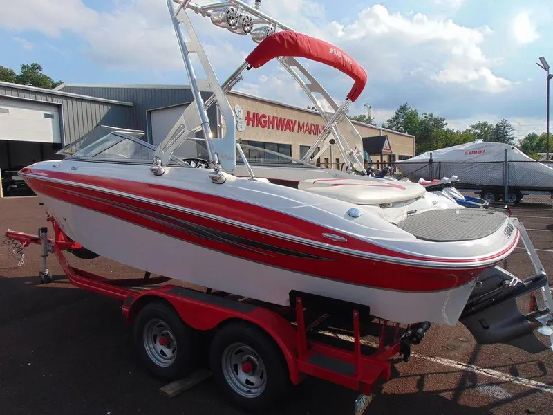 Slide: The Image of 2009 Four Winns H210 boat on red trailer at Highway Marine. - 2