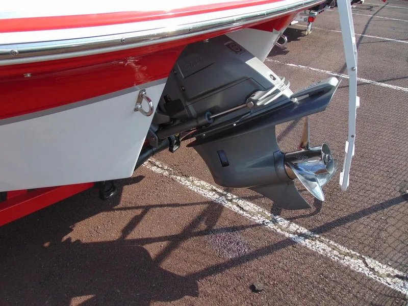 Slide: The Image of 2009 Four Winns H210 boat propeller and stern detail in parking lot. - 3