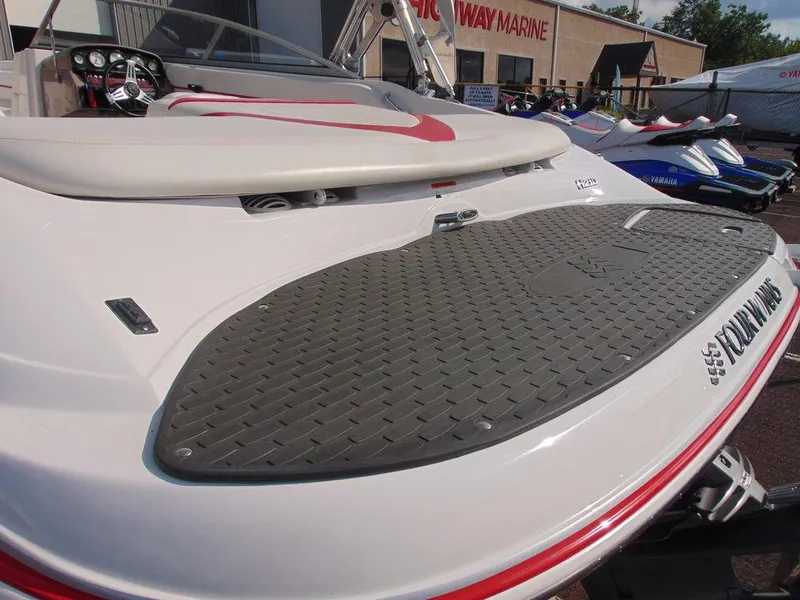 Slide: The Image of 2009 Four Winns H210 boat with swim platform at a marina. - 4