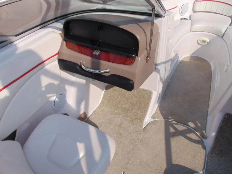 Slide: The Image of Interior of 2009 Four Winns H210 boat with beige and white seating. - 9
