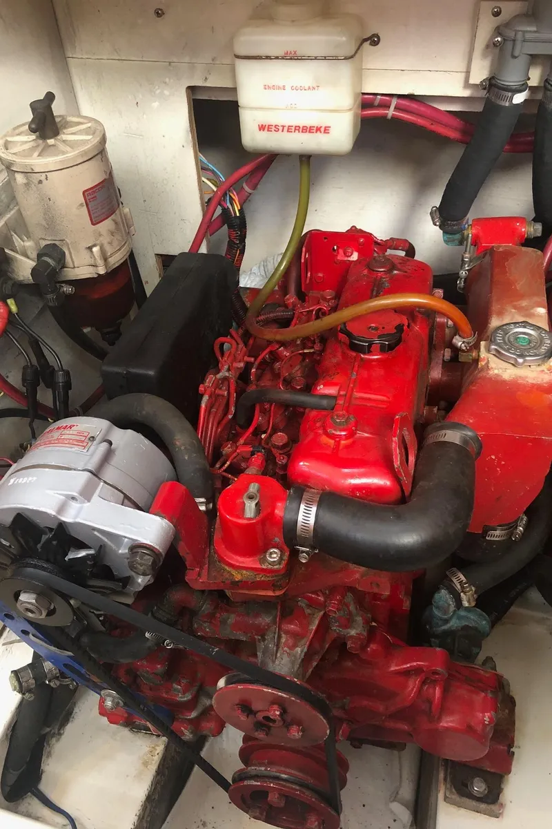 Slide: The Image of Red engine in a 1997 Catalina 400 sailboat, featuring Westebeke components. - 11