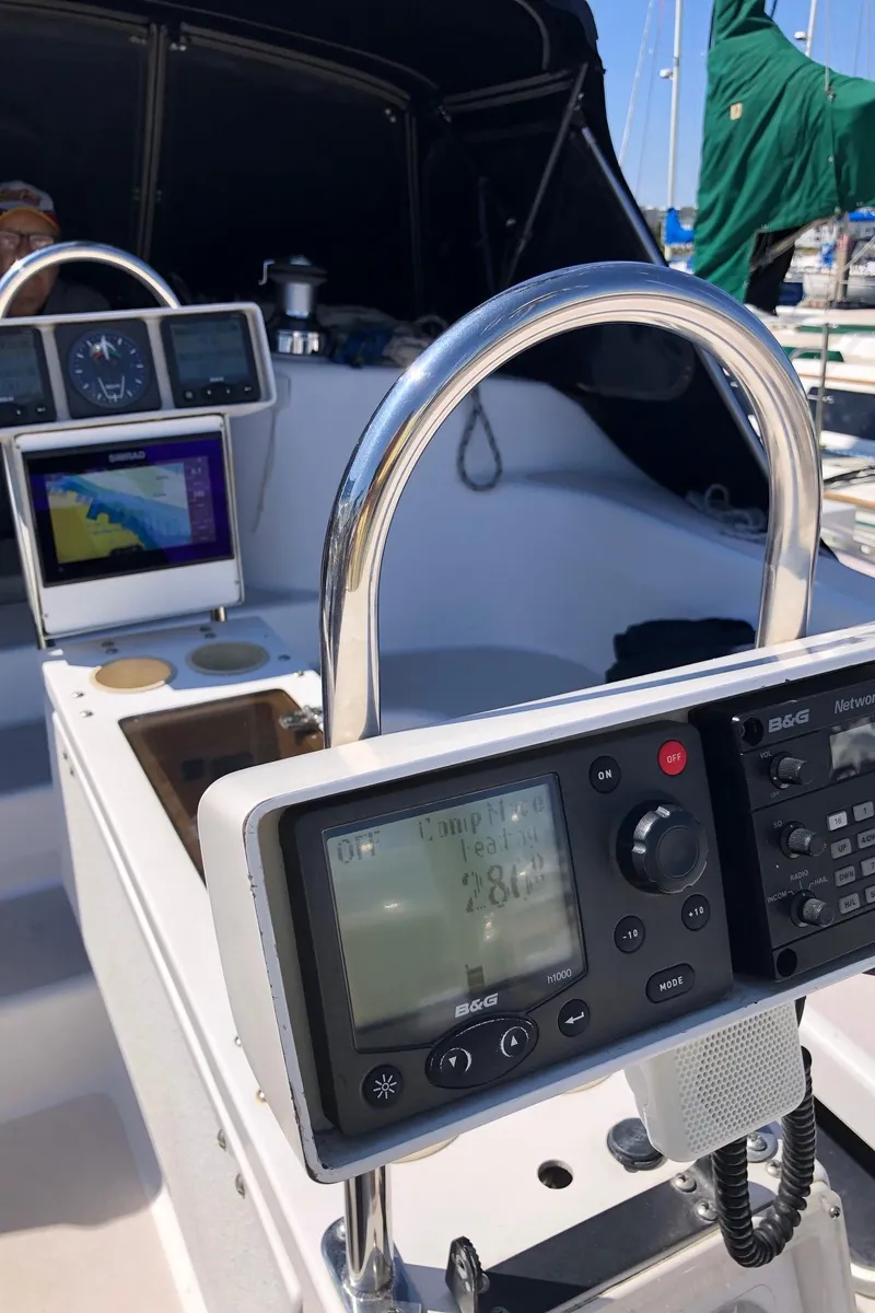 Slide: The Image of 1997 Catalina 400 yacht cockpit with navigation instruments and steering wheel. - 6