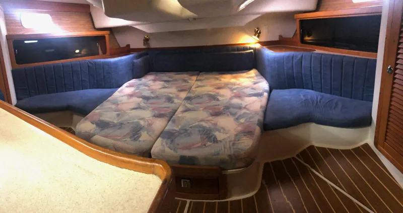 Slide: The Image of Interior cabin of 1997 Catalina 400 sailboat with cozy seating and bed. - 7