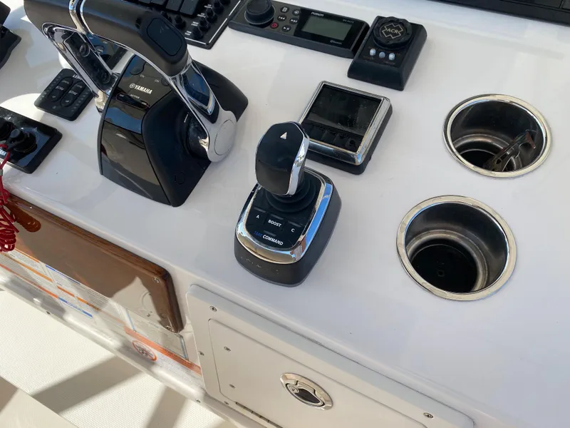 Slide: The Image of Control panel of a 2016 Pursuit S 280 Sport boat with modern navigation equipment. - 14