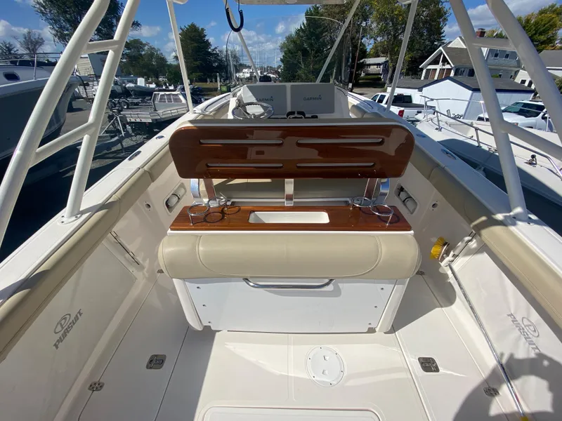 Slide: The Image of 2016 Pursuit S 280 Sport boat interior with seating and storage. - 25