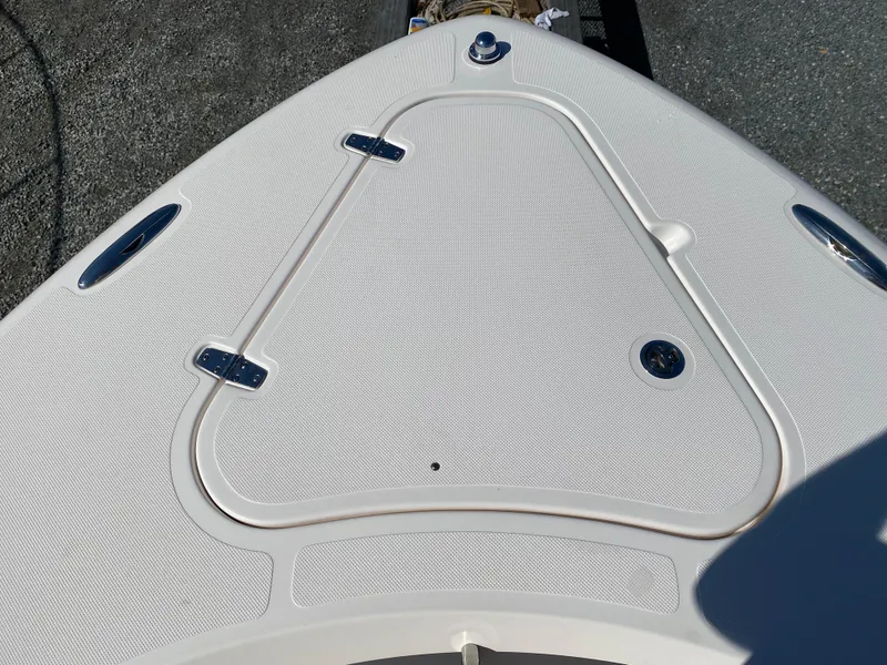 Slide: The Image of 2016 Pursuit S 280 Sport boat deck with textured surface and metal fittings. - 5