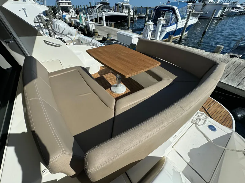 Slide: The Image of Prestige 440 S 2012 yacht with outdoor seating and table at marina. - 16
