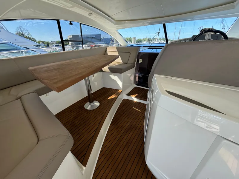 Slide: The Image of Interior of 2012 Prestige 440 S yacht with wooden flooring and seating area. - 22